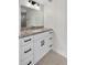 Bright bathroom featuring granite counters, modern vanity with matte black hardware, and recessed lighting at 431 Windward Psge, Clearwater Beach, FL 33767