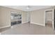 Airy bedroom featuring sliding glass doors to the patio, ample natural light, and neutral color scheme at 431 Windward Psge, Clearwater Beach, FL 33767