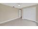 Neutral bedroom showcases a ceiling fan, closet space, and a clean, minimalist design at 431 Windward Psge, Clearwater Beach, FL 33767