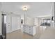 Bright kitchen features a central island, modern appliances, and access to the outdoor space at 431 Windward Psge, Clearwater Beach, FL 33767