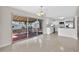 Modern kitchen overlooking outdoor space features white cabinetry, stainless steel appliances, and ample counter space at 431 Windward Psge, Clearwater Beach, FL 33767