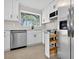 Updated kitchen featuring stainless steel appliances and an island drawer at 431 Windward Psge, Clearwater Beach, FL 33767