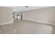 Spacious living area with neutral walls, terrazzo flooring, and an open layout at 431 Windward Psge, Clearwater Beach, FL 33767