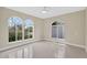 Sun-filled living room showcasing arched windows, neutral walls, and modern flooring at 431 Windward Psge, Clearwater Beach, FL 33767