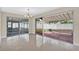 Bright sunroom with sliding doors that lead to the patio and backyard at 431 Windward Psge, Clearwater Beach, FL 33767