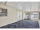 Spacious sunroom with sliding glass doors, natural light, and distinctive flooring at 431 Windward Psge, Clearwater Beach, FL 33767