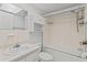 Bright bathroom features a shower-tub combo and coordinated vanity at 4500 E Bay Dr # 106, Clearwater, FL 33764