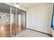 Bedroom featuring a mirrored closet and access to the living area at 4500 E Bay Dr # 106, Clearwater, FL 33764