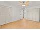 The spacious bedroom boasts hardwood floors and ample closet space with bi-fold doors at 4500 E Bay Dr # 106, Clearwater, FL 33764