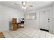 Bright entryway with tile floor, a ceiling fan, and natural light from the front door window at 4500 E Bay Dr # 106, Clearwater, FL 33764