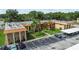 Well-maintained two-story building with palm trees, landscaping and ample parking spaces at 4500 E Bay Dr # 106, Clearwater, FL 33764