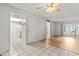 Bright living room view showcasing tile and wood floors and access to kitchen at 4500 E Bay Dr # 106, Clearwater, FL 33764