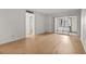 Open living space featuring wood floors and a sliding glass door at 4500 E Bay Dr # 106, Clearwater, FL 33764