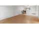 Open-plan living room featuring light colored laminate flooring, and neutral walls at 4500 E Bay Dr # 106, Clearwater, FL 33764