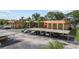 Exterior view of the condo complex's parking area with covered parking spots available for residents and guests at 4500 E Bay Dr # 106, Clearwater, FL 33764