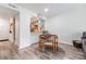 Light filled dining area with modern flooring, dining table, and pass through to kitchen at 4513 S Oak Dr # Q21, Tampa, FL 33611