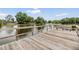 A wooden dock extends over the tranquil lake, providing a peaceful spot for enjoying the surrounding nature at 4513 S Oak Dr # Q21, Tampa, FL 33611