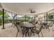 A covered gazebo with picnic tables and chairs, providing a perfect space for outdoor gathering and relaxation at 4513 S Oak Dr # Q21, Tampa, FL 33611