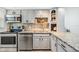 Kitchen with modern stainless appliances, granite countertops and stylish cabinetry at 4513 S Oak Dr # Q21, Tampa, FL 33611