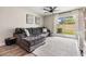 Comfortable living room with large gray couch, patio doors, and outdoor view at 4513 S Oak Dr # Q21, Tampa, FL 33611