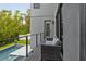 Relax on the outdoor balcony with backyard views and overlooking the beautiful inground pool at 4806 W Euclid Ave, Tampa, FL 33629