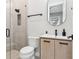 Bathroom boasts modern fixtures, walk-in shower with glass door, stylish vanity, and neutral color scheme at 4806 W Euclid Ave, Tampa, FL 33629