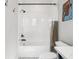 Bright bathroom featuring a white tub, shower with tile surround, and modern fixtures at 4806 W Euclid Ave, Tampa, FL 33629
