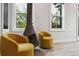 Stylish bedroom showcasing a modern fireplace and natural light streaming through the windows at 4806 W Euclid Ave, Tampa, FL 33629