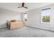 Bright bedroom with two large windows offering natural light and serene views at 4806 W Euclid Ave, Tampa, FL 33629