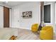 Cozy bedroom featuring warm yellow chairs, a unique fireplace, and a sliding barn door at 4806 W Euclid Ave, Tampa, FL 33629