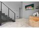 Spacious bonus room featuring light-colored floors, TV, grill, and convenient access to the backyard at 4806 W Euclid Ave, Tampa, FL 33629