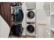 Well-equipped walk-in closet with ample storage and a stacked washer/dryer unit at 4806 W Euclid Ave, Tampa, FL 33629