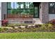 Stunning view of a modern home entrance with custom address plaque and lush landscaping at 4806 W Euclid Ave, Tampa, FL 33629