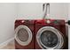 A red Samsung washer and dryer set are the focal point of this convenient laundry space at 4806 W Euclid Ave, Tampa, FL 33629