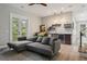 Living room featuring a modern ceiling fan, French doors, and bar area with custom shelving and drink cooler at 4806 W Euclid Ave, Tampa, FL 33629