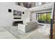 Open living space with polished concrete floors, cozy seating, and large windows at 4806 W Euclid Ave, Tampa, FL 33629