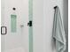 Bright shower featuring white subway tile and decorative scallop-patterned accent at 4806 W Euclid Ave, Tampa, FL 33629