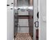 Luxurious walk-in shower featuring dual shower heads, built-in shelves, and stylish tiling at 4806 W Euclid Ave, Tampa, FL 33629
