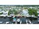 Aerial view of a waterfront community showing multiple docks and boats along a canal with stunning residential homes at 4931 Pelican Dr, New Port Richey, FL 34652