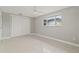 This comfortable bedroom offers neutral paint, carpet, a closet, and a window at 4931 Pelican Dr, New Port Richey, FL 34652