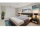 This staged bedroom shows the bed, side tables, lamps, and matching decor at 4931 Pelican Dr, New Port Richey, FL 34652