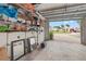 This garage features a wall of tools and storage with a view to the outside at 4931 Pelican Dr, New Port Richey, FL 34652