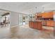 Bright kitchen boasts center island, stainless appliances, tile flooring, and pool views at 4931 Pelican Dr, New Port Richey, FL 34652