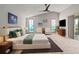 Spacious main bedroom features soaring ceilings, bright windows, ceiling fan, and neutral carpeting at 4931 Pelican Dr, New Port Richey, FL 34652