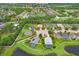 A property surrounded by lush greenery, ponds, and mature trees in a serene neighborhood at 5013 119Th E Ter, Parrish, FL 34219