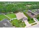 A beautiful fenced yard with a well-maintained lawn, mature landscaping, and a cozy patio area at 5013 119Th E Ter, Parrish, FL 34219