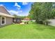 Spacious backyard with lush green grass, privacy fence and screened patio at 5013 119Th E Ter, Parrish, FL 34219