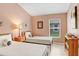 Comfortable bedroom featuring two twin beds, a window, and a simple yet inviting decor at 5013 119Th E Ter, Parrish, FL 34219