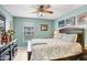Cozy bedroom with a ceiling fan and comfortable queen-sized bed at 5013 119Th E Ter, Parrish, FL 34219