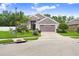 Charming single-Gathering home features a well-manicured lawn, lush landscaping, and a two-car garage at 5013 119Th E Ter, Parrish, FL 34219